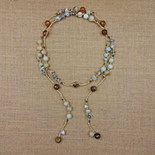 Load image into Gallery viewer, Necklace Length:45" Long. Major Beads/material: Amazonite; larimar; hematite. Color: Blue. Findings: NA. Clasp: NA. Workmanship: Exquisite workmanship with double knotting over each stone in natural colored mixed cotton thread. Feature(s): Bohemian-chic wrap necklace is embellished with larimar and amazonite stones. Versatile length. Tie it in a knot, wrap it around waist or loop it around neck and leave the ends loose. Many ways to wear this necklace.