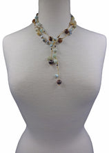 Load image into Gallery viewer, Necklace Length:45" Long. Major Beads/material: Amazonite; larimar; hematite. Color: Blue. Findings: NA. Clasp: NA. Workmanship: Exquisite workmanship with double knotting over each stone in natural colored mixed cotton thread. Feature(s): Bohemian-chic wrap necklace is embellished with larimar and amazonite stones. Versatile length. Tie it in a knot, wrap it around waist or loop it around neck and leave the ends loose. Many ways to wear this necklace.